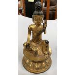 A Chinese gilt bronze figure of a seated buddha in prayer position with leaf mark to base