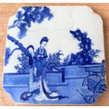 A 19th century Chinese blue and white shaped square blue and white tile with woman on balcony,