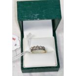 A 5 stone diamond ring stamped '18ct Plat', 2.2 gm, centre stone 4.2 mm approx, size L/M