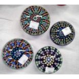 Four millefiori glass paperweights