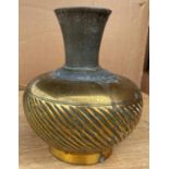 An Indo-Persian mixed metal vase with ribbed decoartion and text above, height 19.5cm