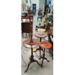 A turned mahogany standard lamp and occasional table; 2 wine tables