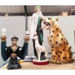 An Art Deco style figure of a 'flapper', 65 cm; a plaster figure of a leopard, 50 cm; a similar lamp