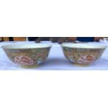 A pair of Chinese famille jaune rice bowls with 4 dragon panels to exterior, central dragon to
