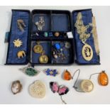 A selection of costume jewellery, cufflinks etc in leather case
