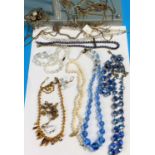 A selection of blue and other crystal necklaces; etc.