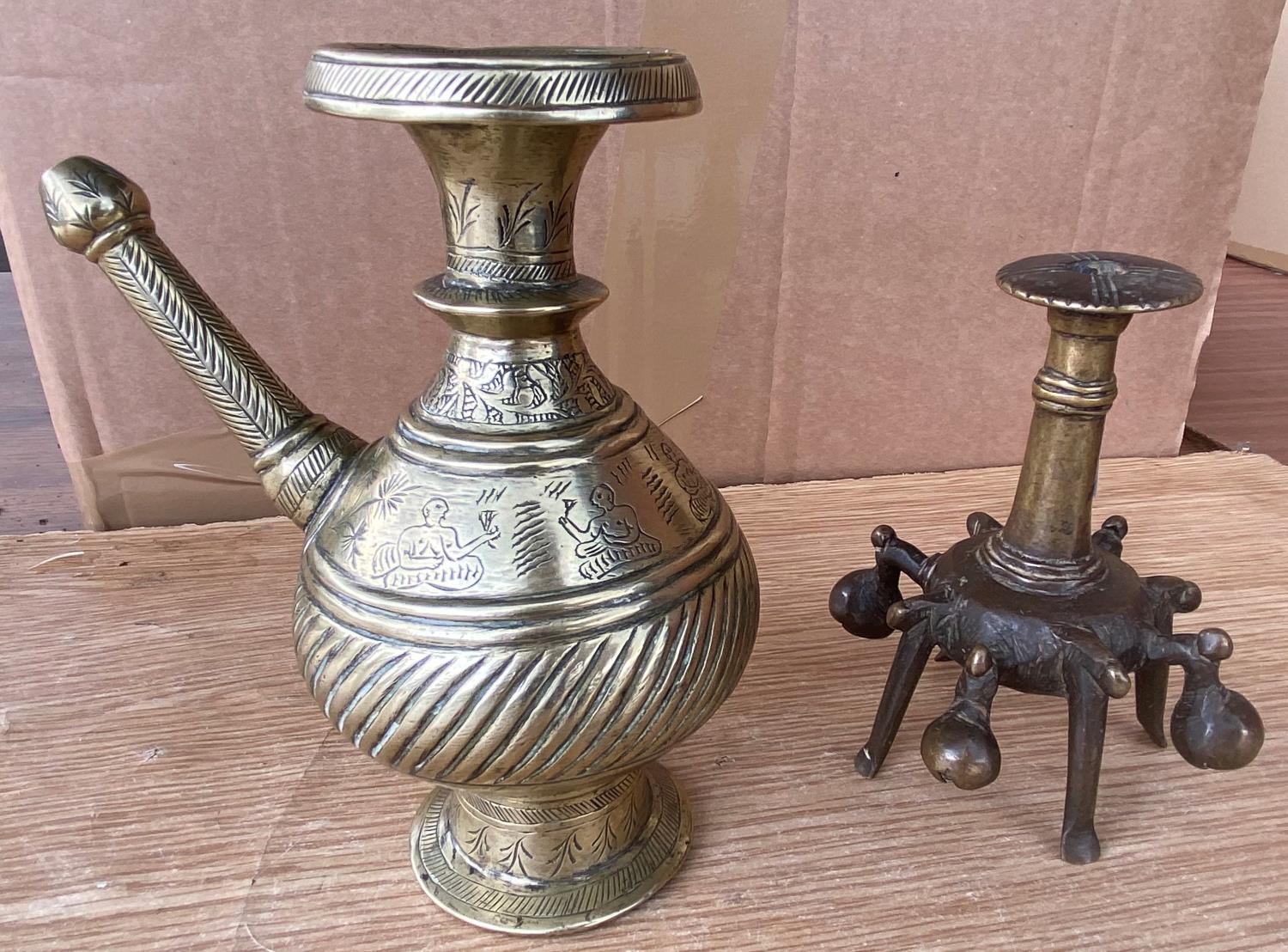 An Indian bronze water pourer and an Indian bronze bell stand