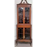 An Edwardian inlaid mahogany corner display cabinet in the Sheraton style, full height, enclosed