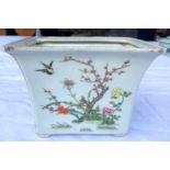 A small rectangular Chinese planter decorated with flowers and birds, 6 character mark to base,