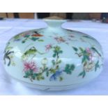 A Chinese famille rose shallow lidded bowl with internal divisions, decorated with flowers and