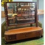 A Georgian mahogany free standing dressing table mirror with drawers to base, width 65 cm; an oval