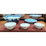 A Chinese squared blue and white bowl (restored); a blue and white dish and three Chinese Tek Sing