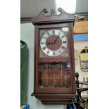A mahogany cased reproduction Acctim 31 day wall clock. 70cm