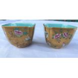 A pair of Chinese squared tea bowls with gilt and polychrome decoration, turquoise interior, red