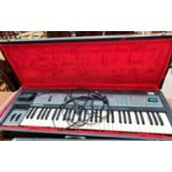 A vintage Peavey Ensonic SQ 80 Crass Wave electric keyboard/Synthesiser in hard carry case