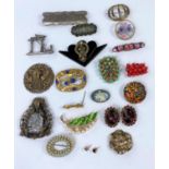 A selection of costume brooches.