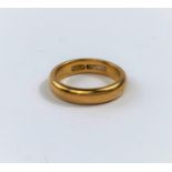 A 22 carat hallmarked gold wedding ring, 8.1 gm