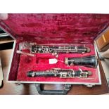 A cased wooden Artia Clarinet stamped 1837, supported by Boosey &