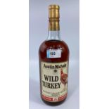 A large bottle of Austin Nichols Wild Turkey Kentucky Straight Bourbon whiskey 8 year old 101% proof