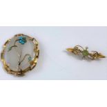 An Edwardian bar brooch set seed pearls and peridot, stamped '15 ct', 3.5 gm; a gilt metal oval