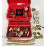 A red leather jewellery box and costume jewellery