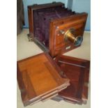 A Dollond of London mahogany cased plate camera and plates.