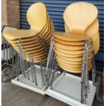 A modern set of 15 stacking chairs in chrome and moulded plywood, in the manner of Arne Jacobsen for