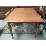 A mid 20th century rectangular teak extending dining table with internal leaf by Dalescraft Fine