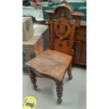 A late Victorian Golden oak hall chair