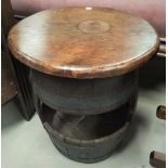 An Edwardian mahogany occasional table with circular top; a small oak bookcase; a barrel stool