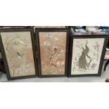 Three early 20th Chinese large embroidered silk pictures, birds in trees, framed and glazed