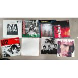 A selection of records including The Clash, The Jam, U2 etc