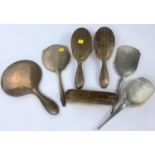 A selection of hallmarked silver backed mirrors and brushes.