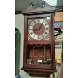 A mahogany cased reproduction Acctim 31 day wall clock. 70cm