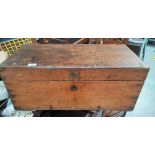 A small antique stained wood campaign chest with brass corners.