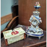 A porcelain reproduction French quartz mantel clock, blue and gilt with floral decoration and a John