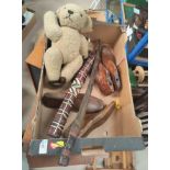 A tribal sword in a feather scabbard; a teddy and a selection of shoe trees/shapers.