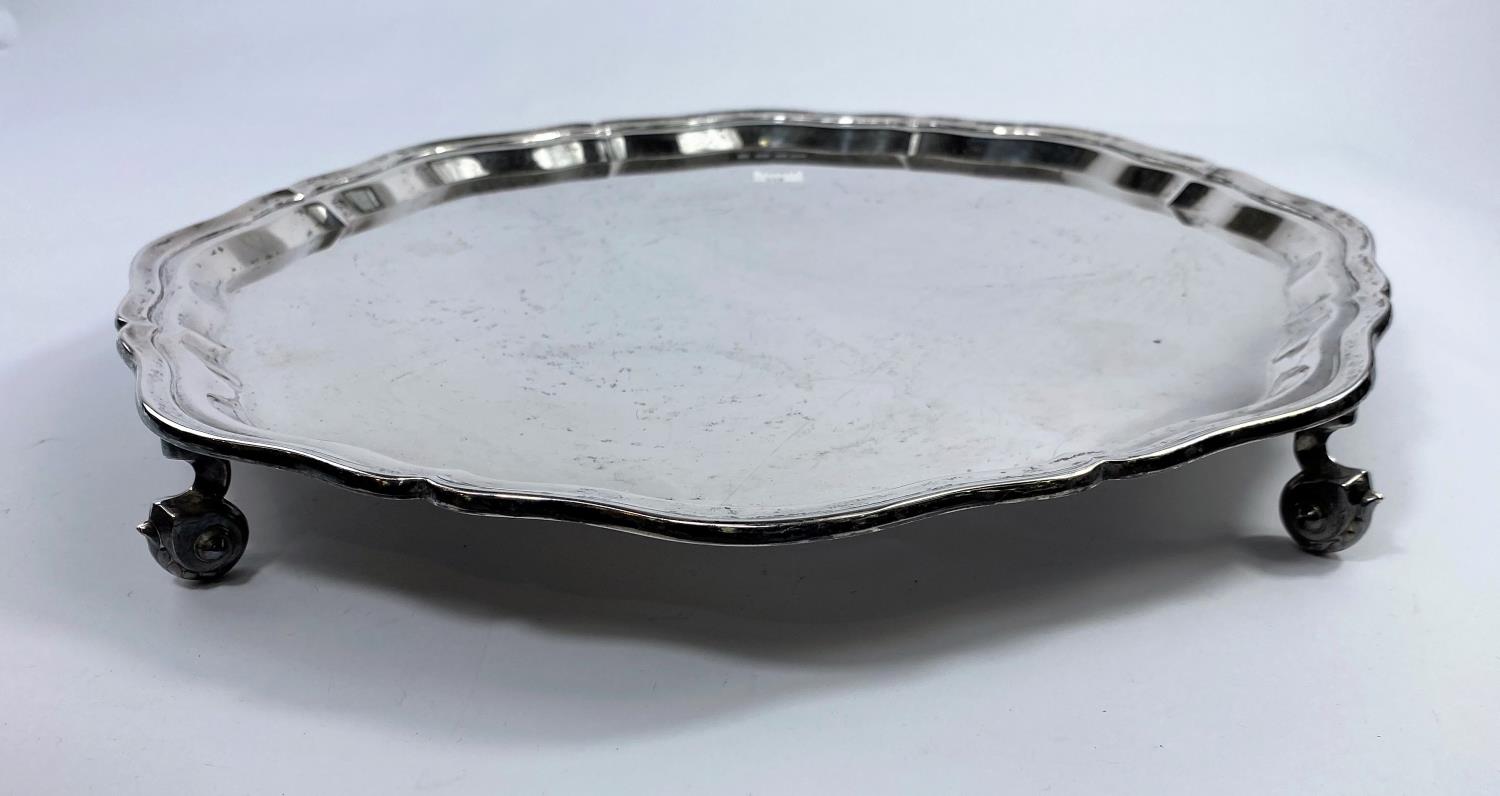 A hallmarked silver circular salver with wavy rim, on circular scroll feet, Sheffield 1951, diameter - Image 2 of 3