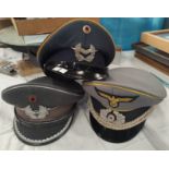 Three reproduction German military caps.