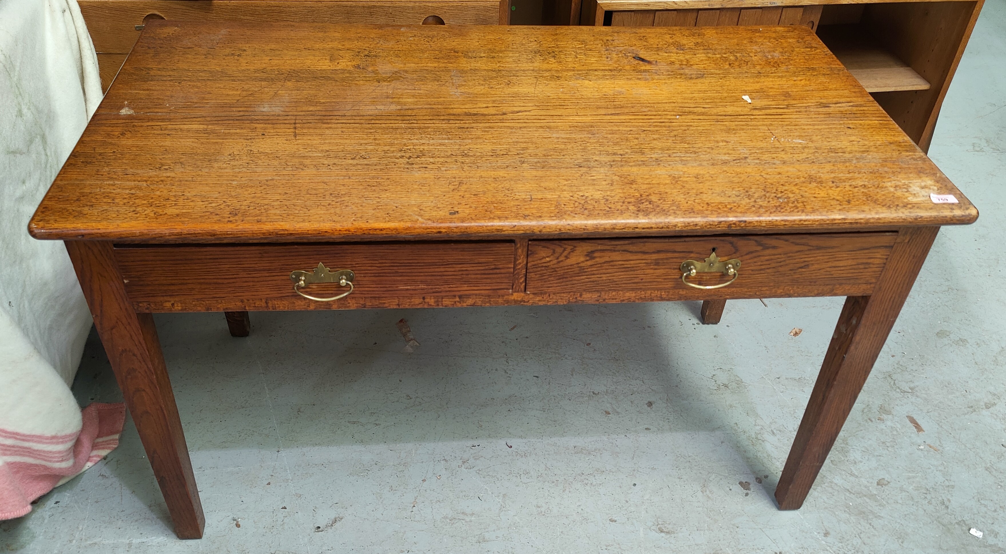 A reproduction oak dining suite with linen fold decoration comprising refectory table; 6 ladder back