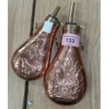 A brass mounted copper flask American style embossed decoration, 20cm and another similar, 16cm