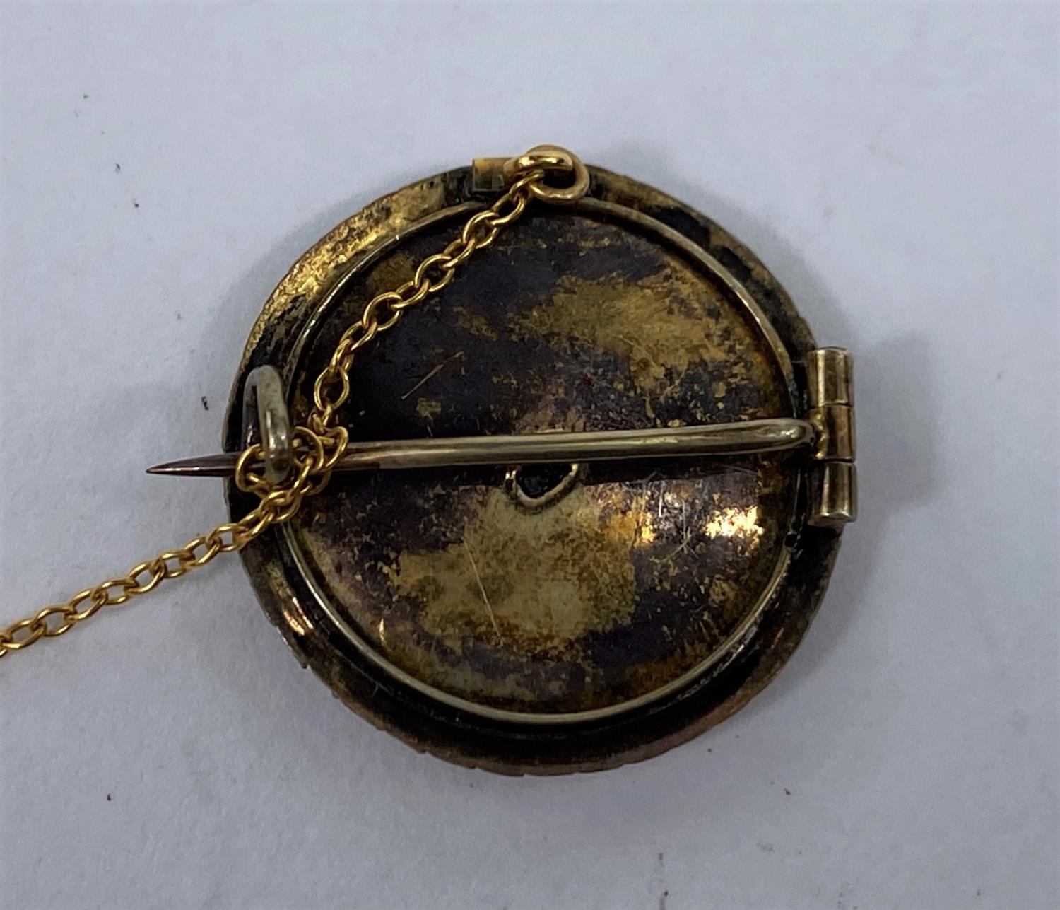 A brooch with half length miniature portrait of a young woman in a bonnet, bordered by seed - Image 2 of 2