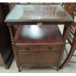 A reproduction mahogany occasional table with rectangular inset leather top; a mahogany