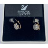 A pair of Swarovski cluster gem set earrings, cased