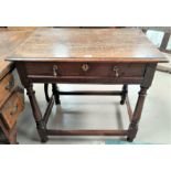 An early 19th century oak country made side table with frieze drawer and brass drop handles, width