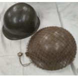 A British pattern steel helmet with webbing and a helmet shell.