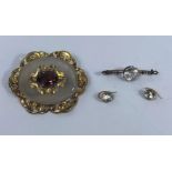 A Victorian large ornate gilt metal brooch set amethyst coloured stone; a bar brooch set large