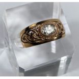 A 9 carat hallmarked gold period style ring set clear oval stone, the split shank with pierced