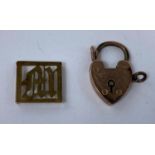 A 9 carat hallmarked gold heart lock; a yellow metal pierced 'M' link, stamped '9ct', 3.9 gm