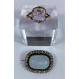 A 19th century opal brooch in paste setting, opal 18 x 12 mm; a 9 carat gold ring